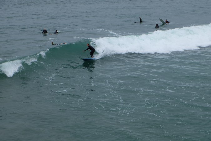 Surfer riding a wave at Pacific Beach
