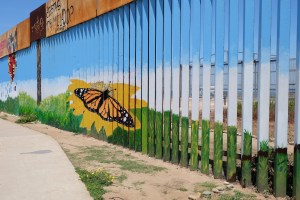 Art decorating the border fence