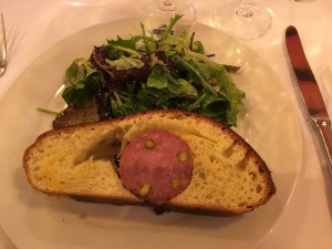Sausage with pistachios in brioche