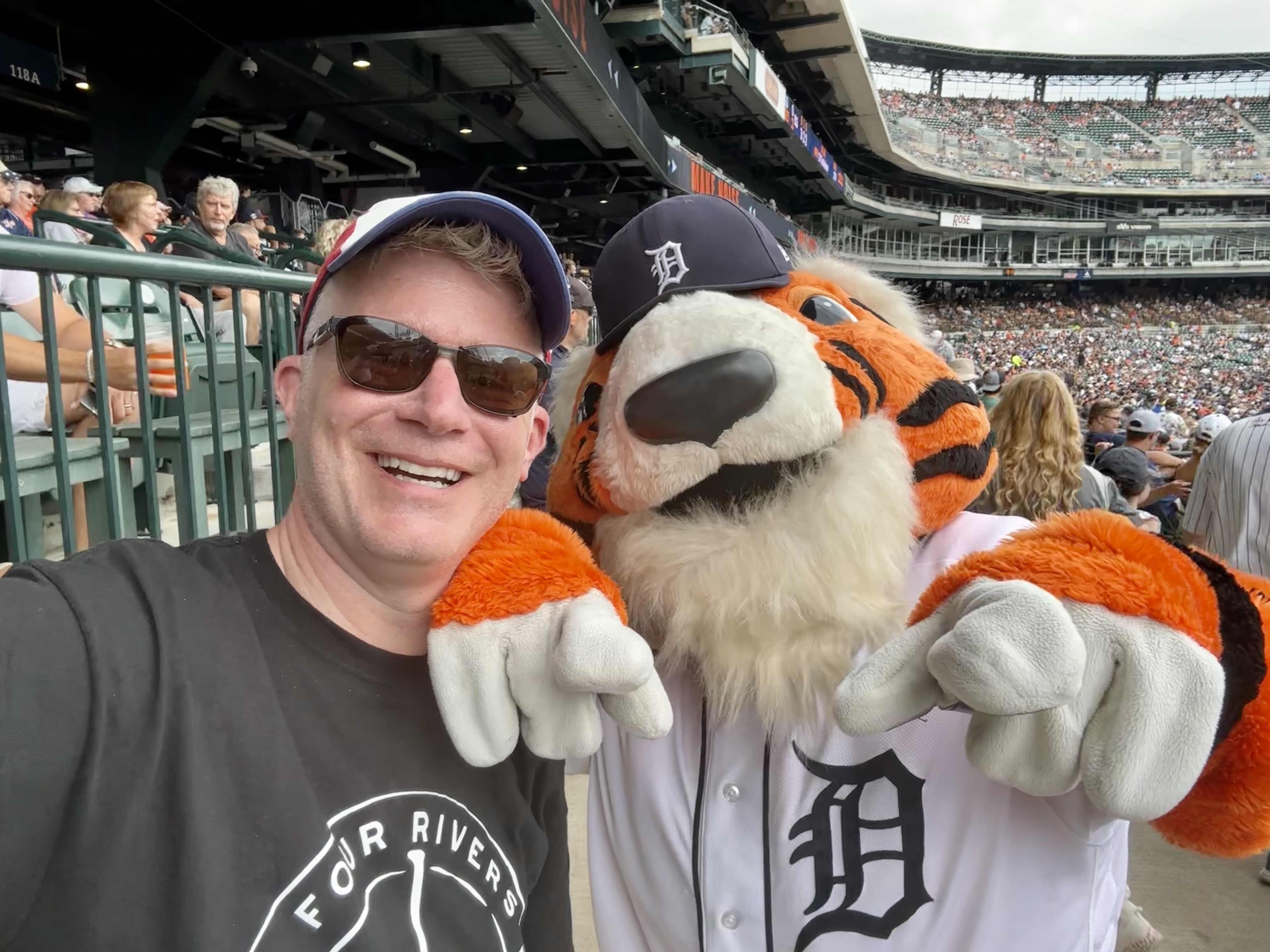 With Paws, the mascot of the Detroit Tigers