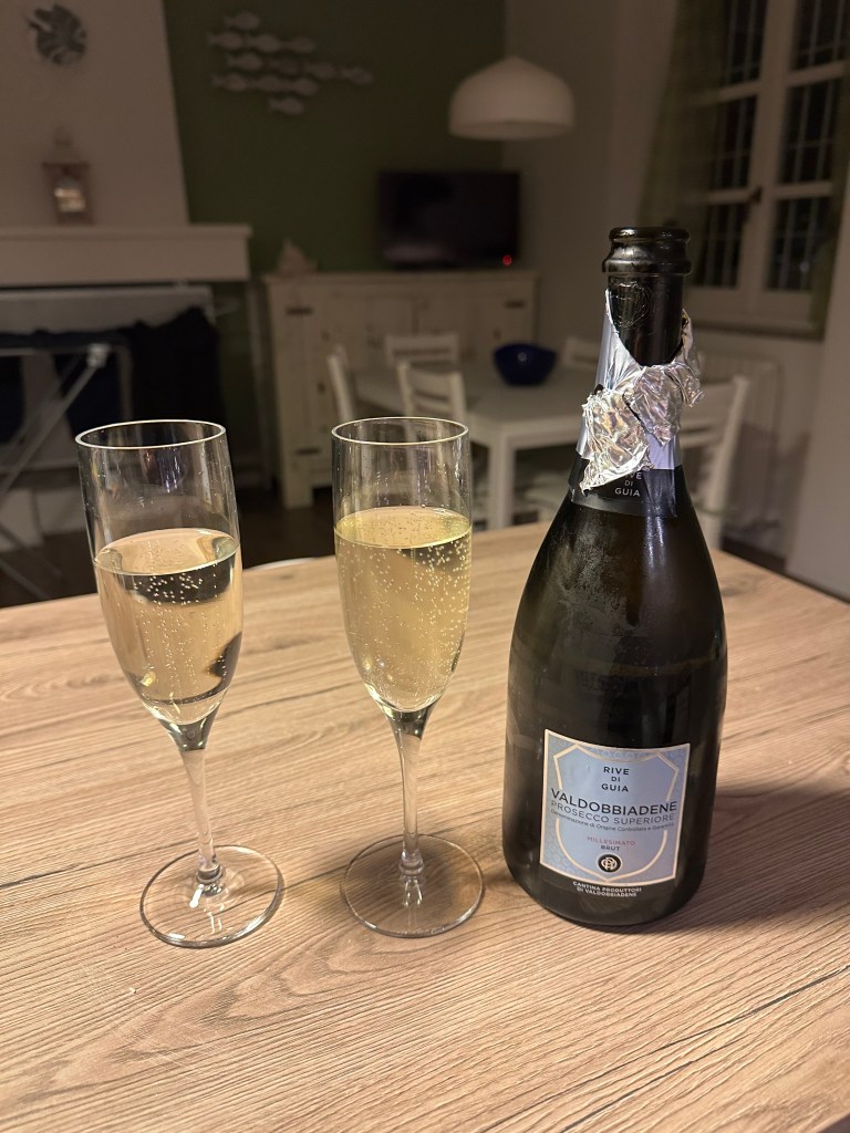 Drinking bubbly in Dorio, Italy