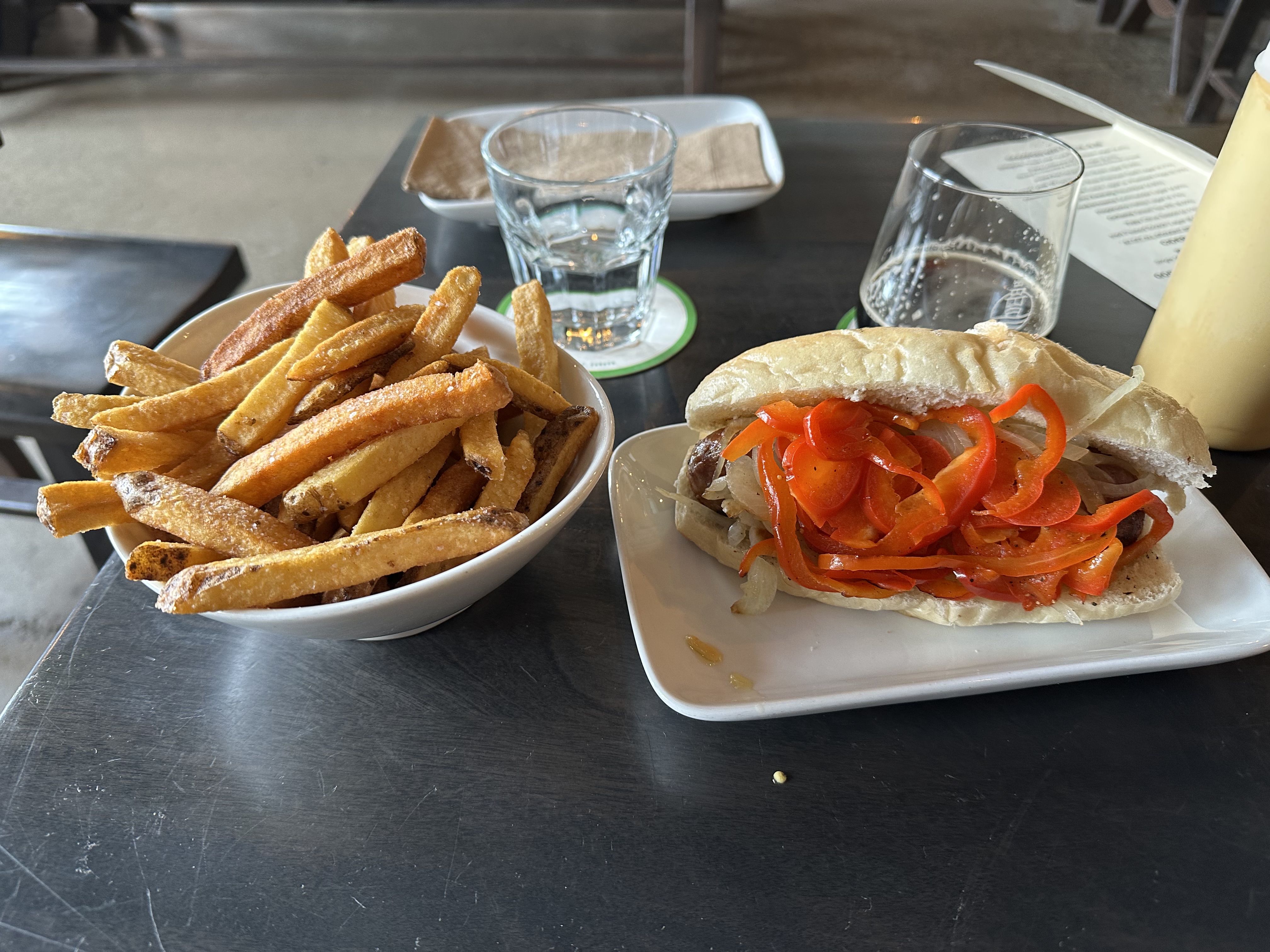 Bratwurst and duck fat fries at Godspeed Brewing in Toronto