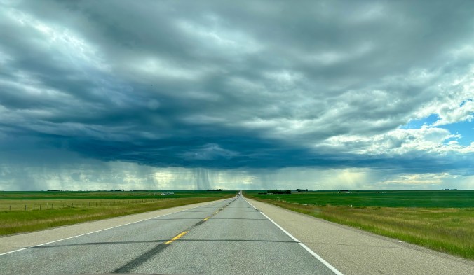 Prairie highway during a storm in Alberta