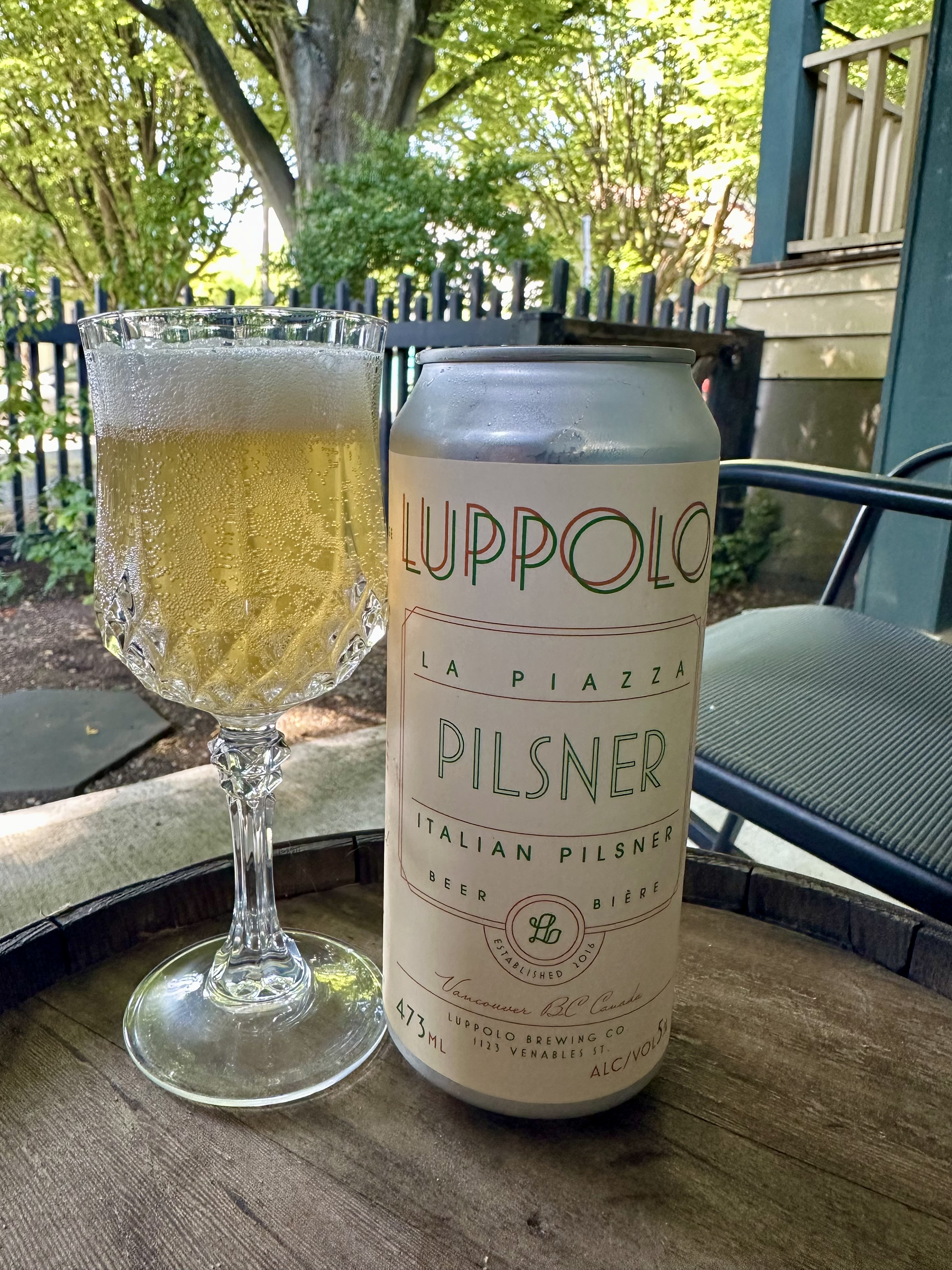 Relaxing with a craft beer on my Vancouver rental's front porch