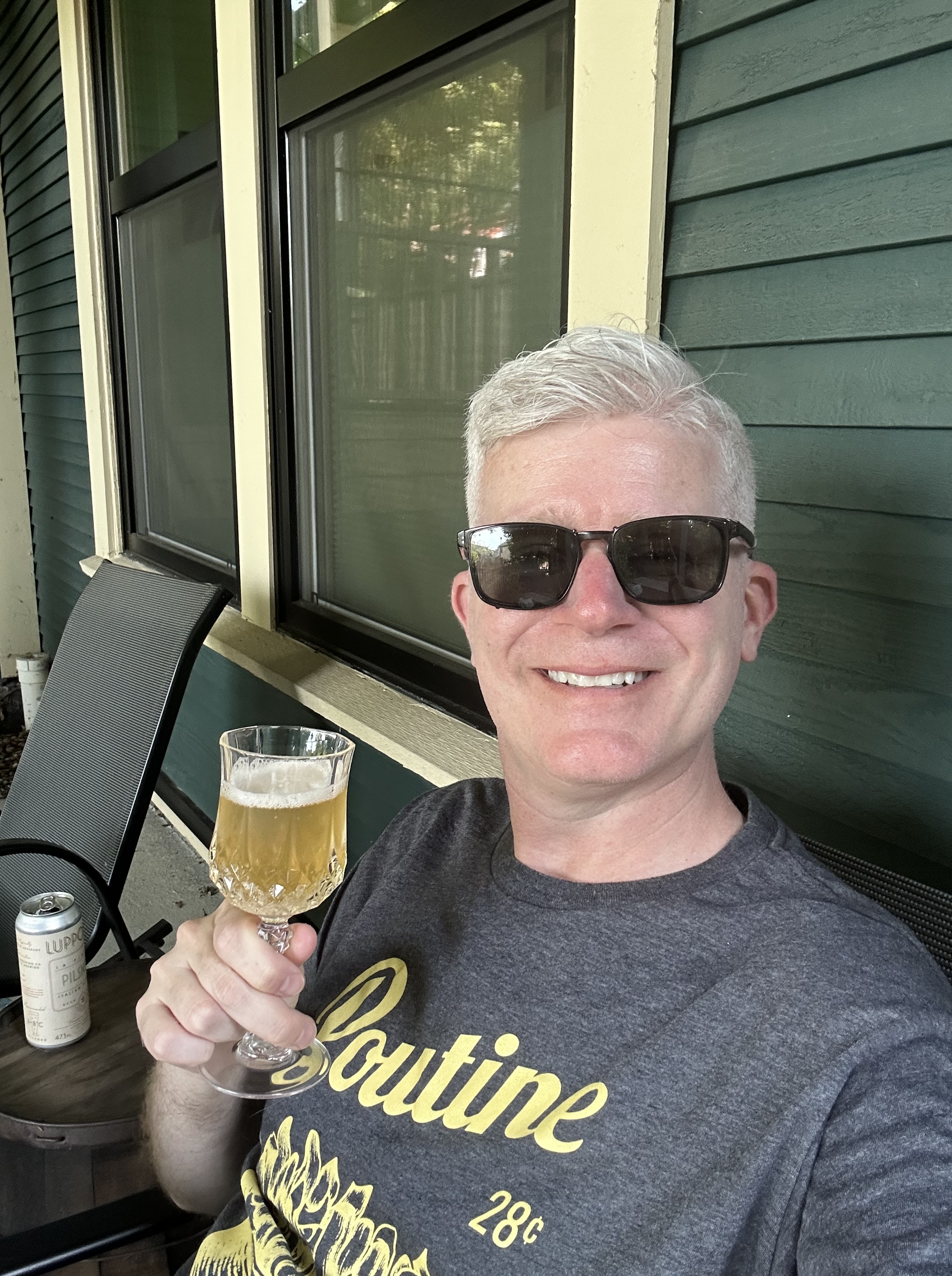 Relaxing with a craft beer on my Vancouver rental's front porch