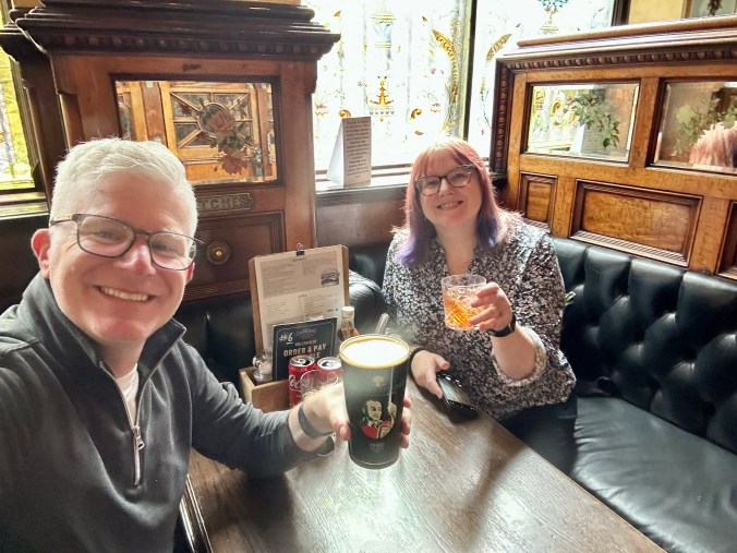 Enjoying drinks at the Crown Liquor Saloon in Belfast